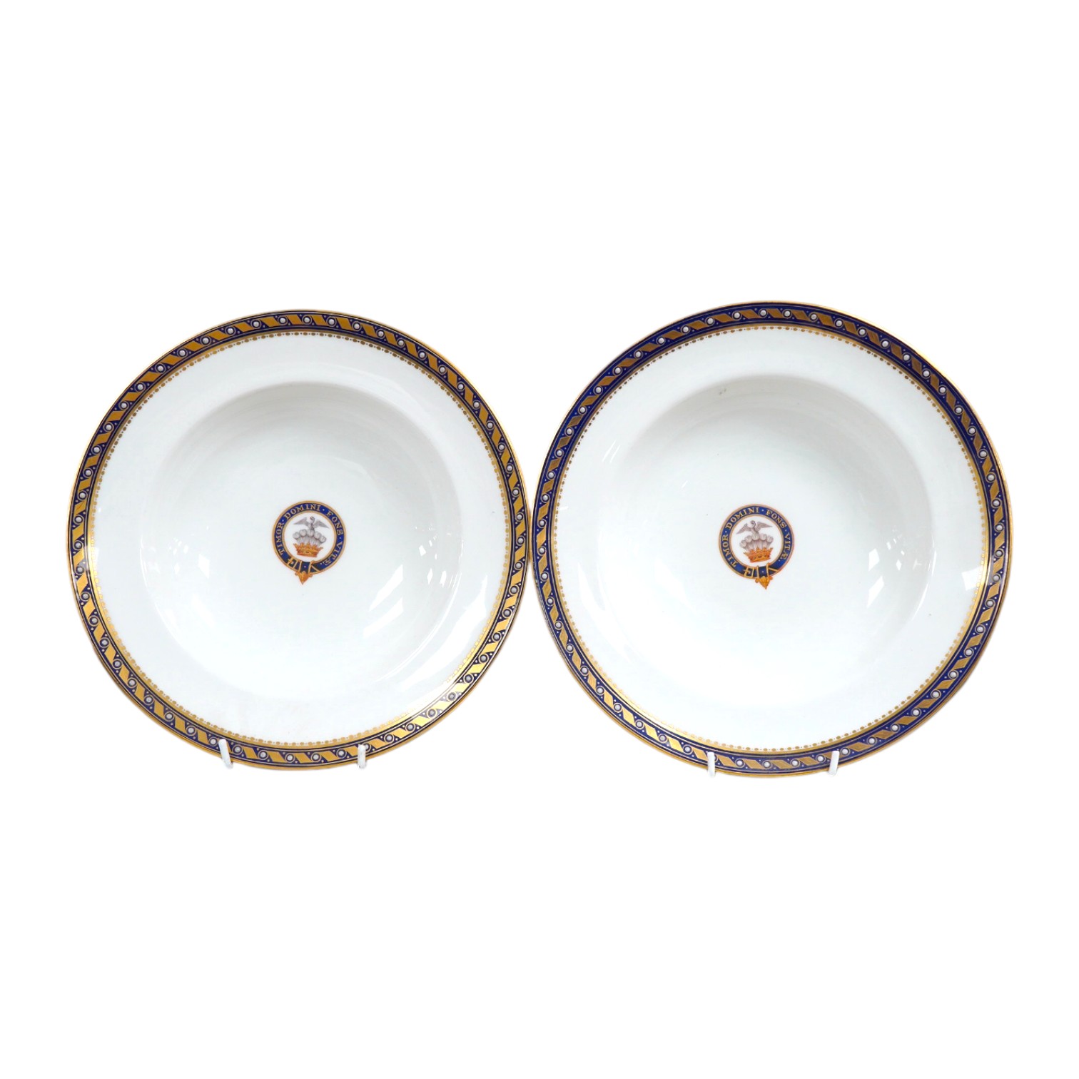 A pair of Minton armorial porcelain soup dishes with Latin motto, 25cm in diameter. Condition - good